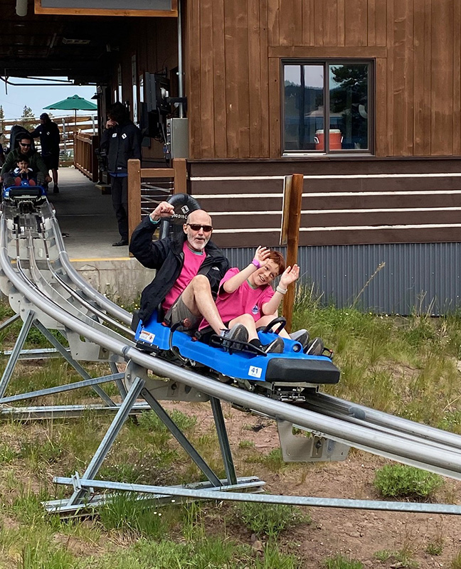 Guide and camper on Alpine Slide