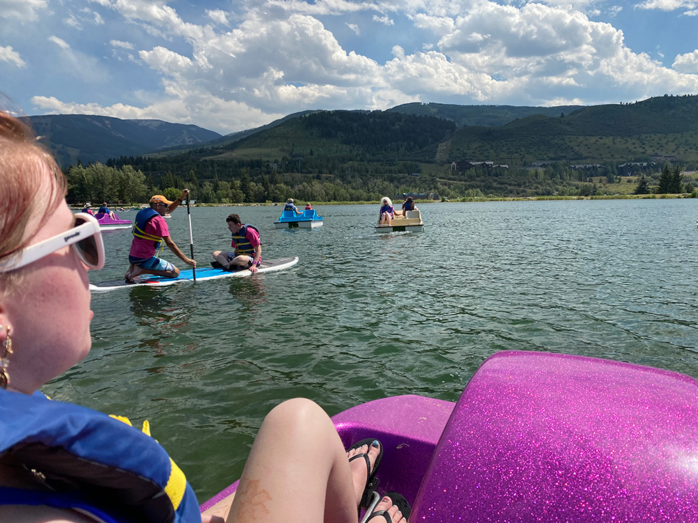 Paddleboarders and Pedal Boats on Lake