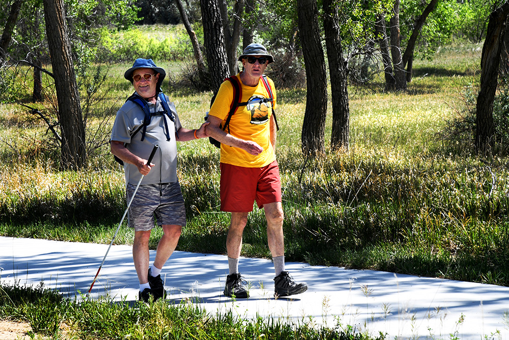 Walker and guide on trail