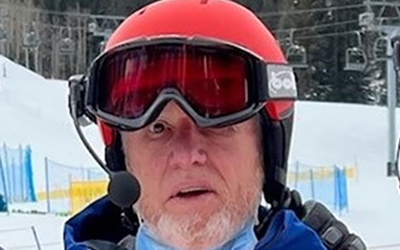 Bill Johnson wearing a ski helmet with ski goggles