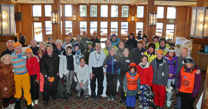 Group photo of all First Tracks participants in ski lodge